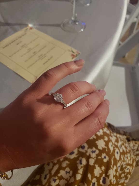 Oval diamond ring on hand