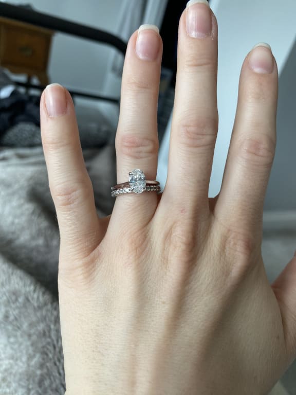 Oval diamond ring on hand