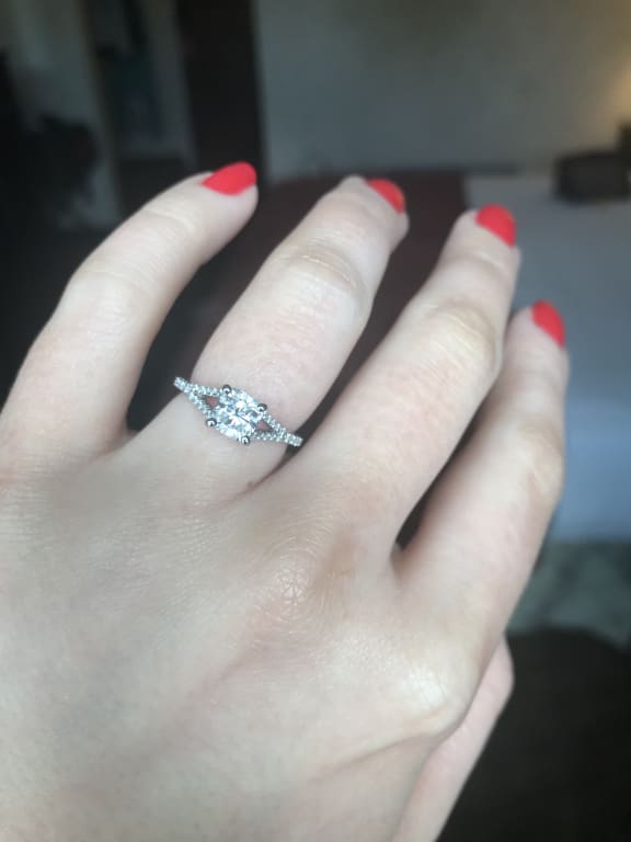 Oval diamond ring on hand