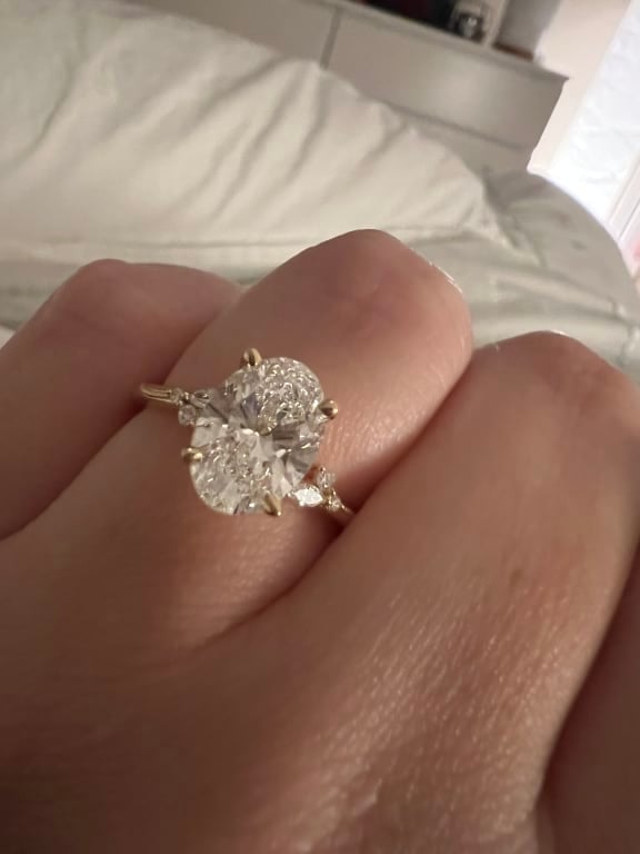 Oval diamond ring on hand