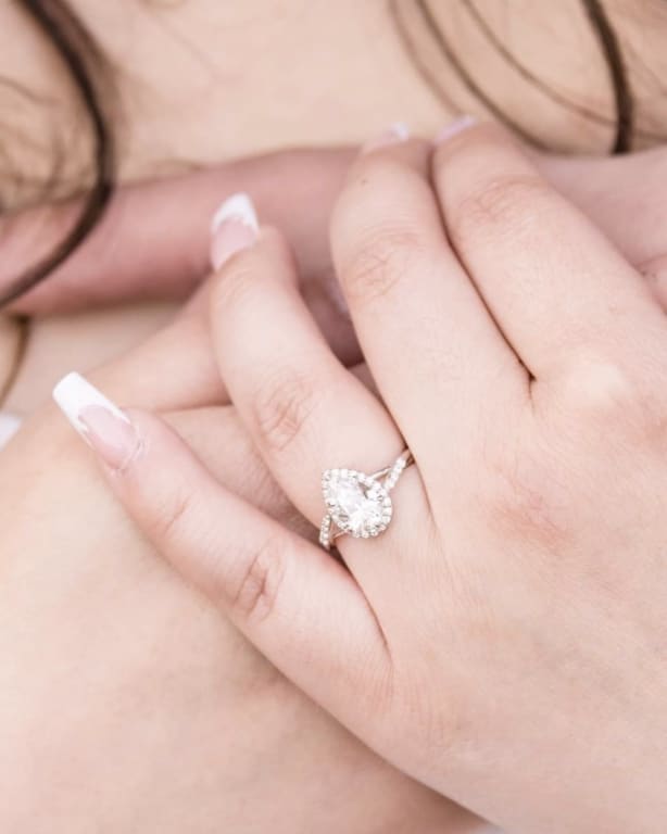 Oval diamond ring on hand