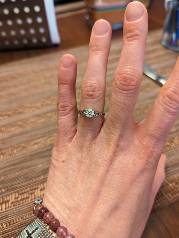 Oval diamond ring on hand