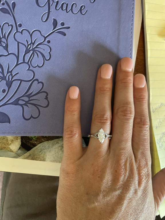Oval diamond ring on hand