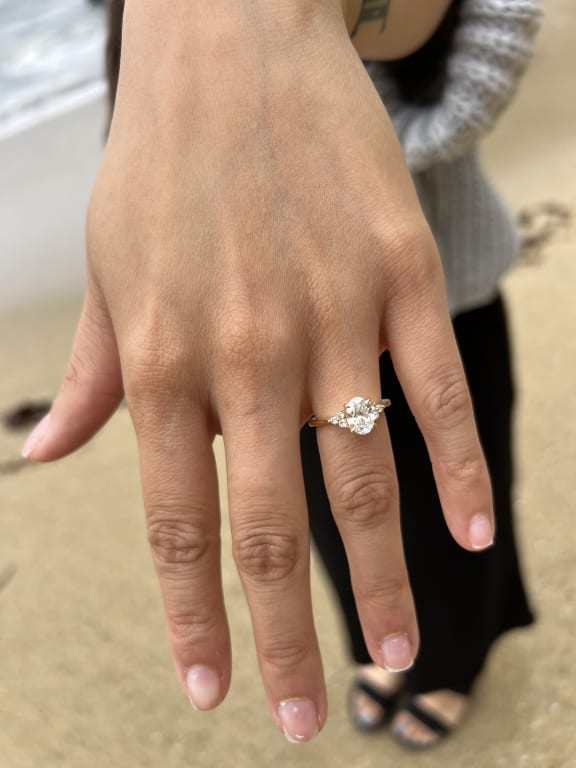 Oval diamond ring on hand