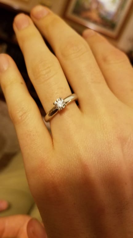Oval diamond ring on hand