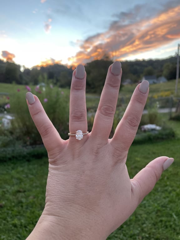 Oval diamond ring on hand