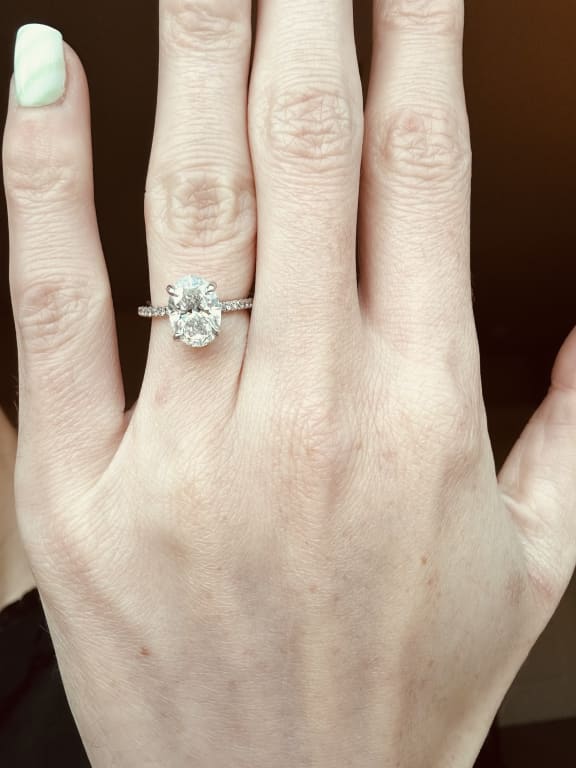 Oval diamond ring on hand
