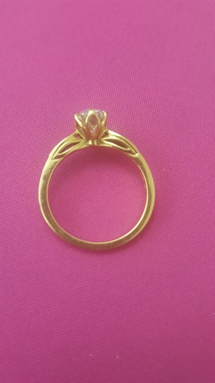 Oval diamond ring on hand