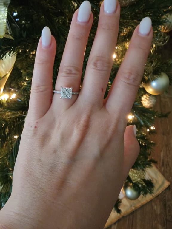 Oval diamond ring on hand