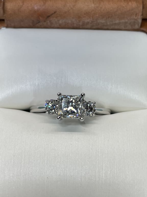 Oval diamond ring on hand