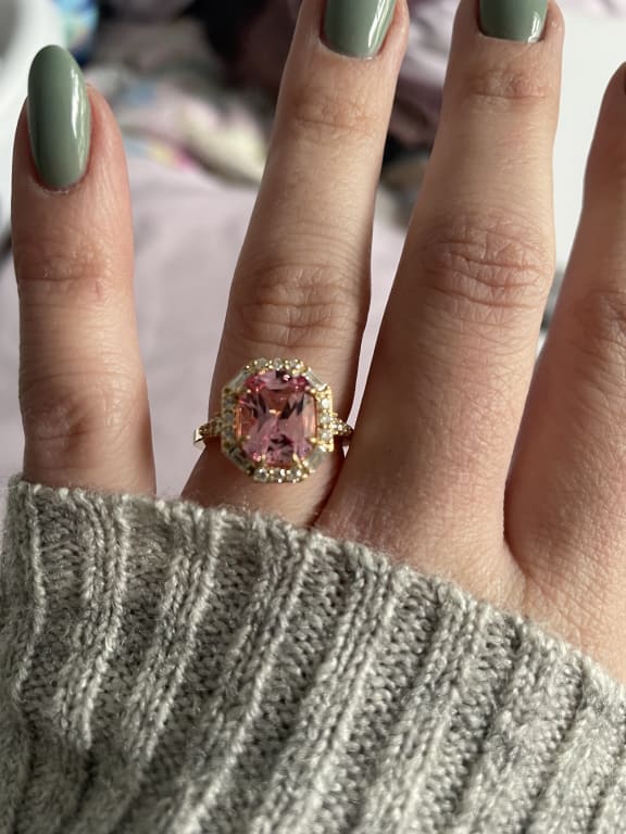 Oval diamond ring on hand