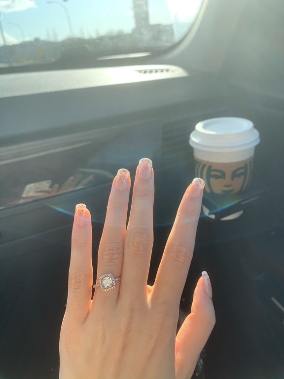 Oval diamond ring on hand