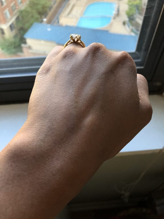 Oval diamond ring on hand