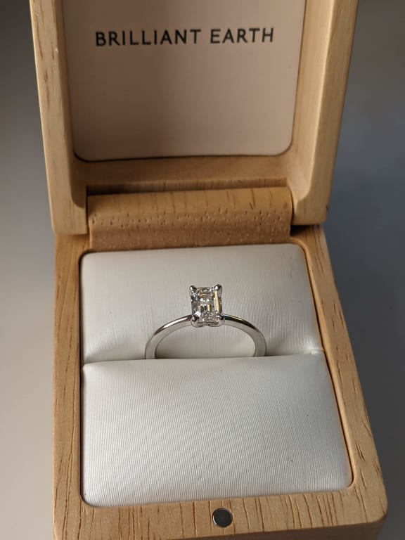 Oval diamond ring on hand