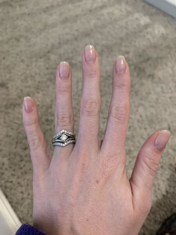 Oval diamond ring on hand