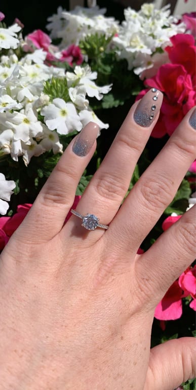 Oval diamond ring on hand