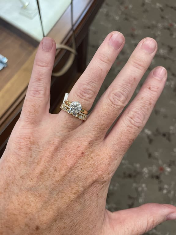 Oval diamond ring on hand