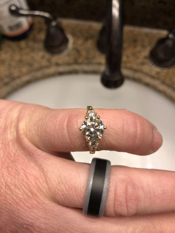 Oval diamond ring on hand