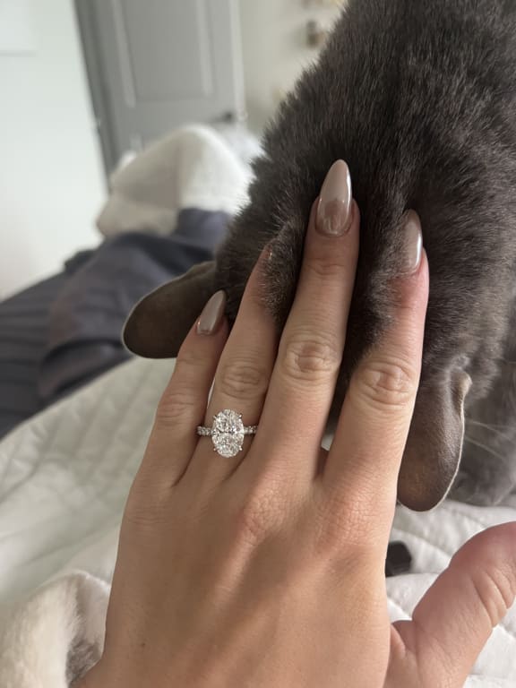 Oval diamond ring on hand