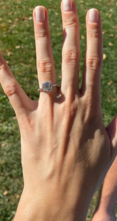 Oval diamond ring on hand
