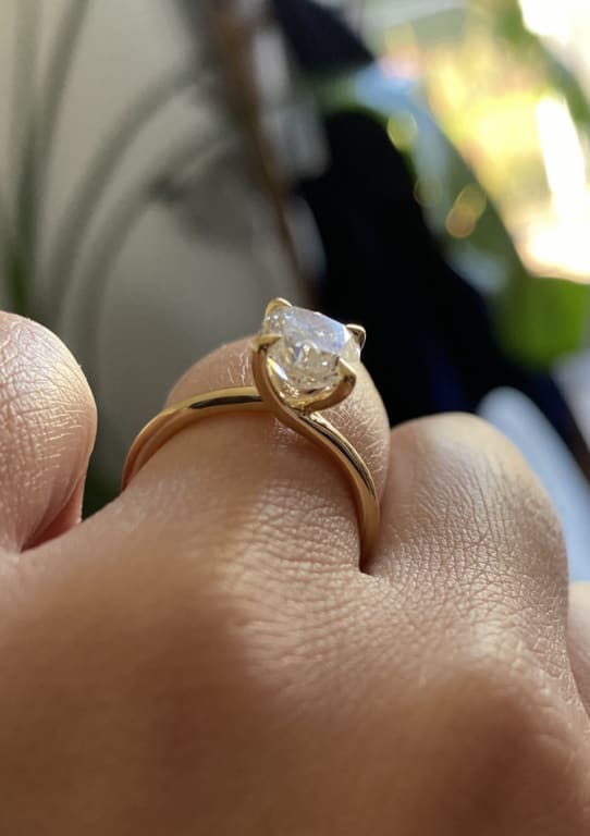 Oval diamond ring on hand