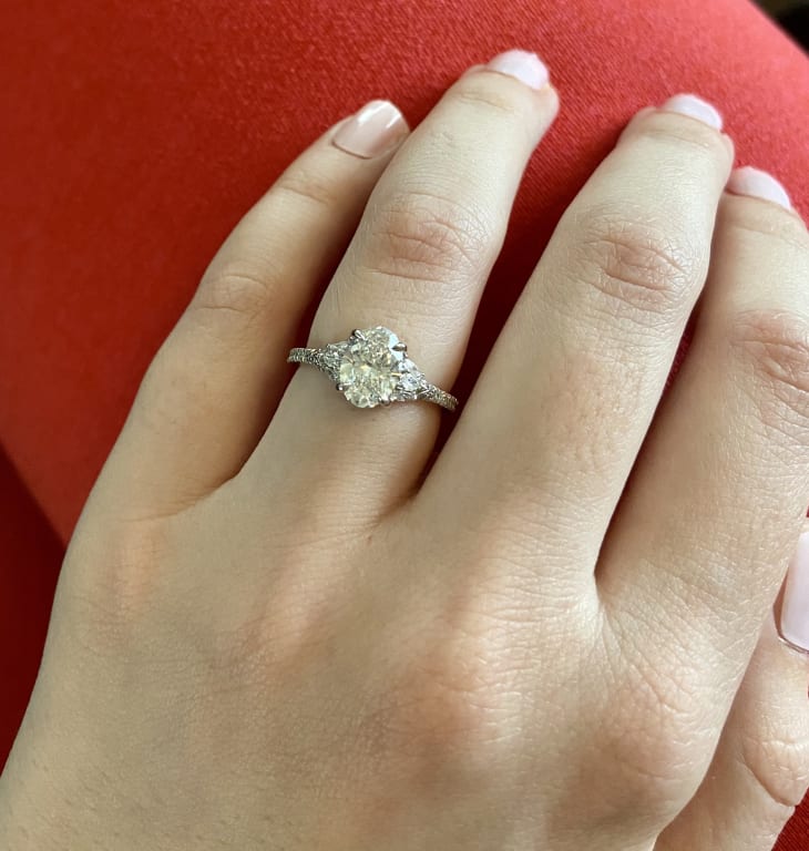 Oval diamond ring on hand