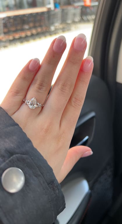 Oval diamond ring on hand