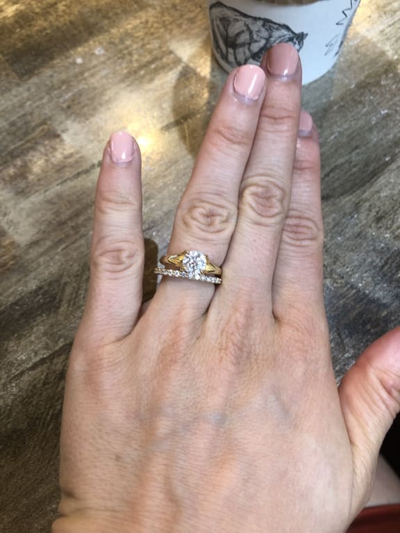 Oval diamond ring on hand