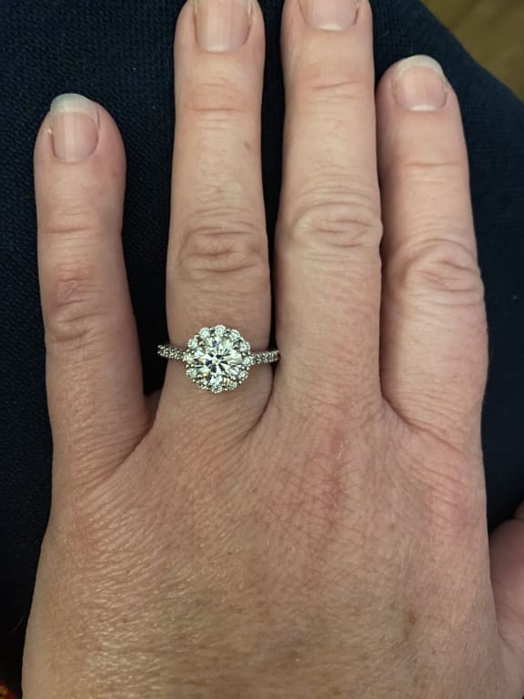 Oval diamond ring on hand