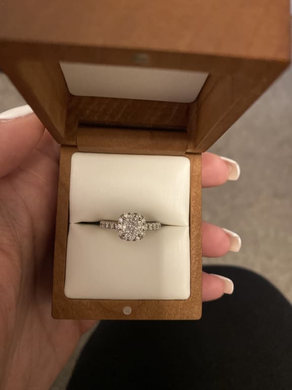Oval diamond ring on hand