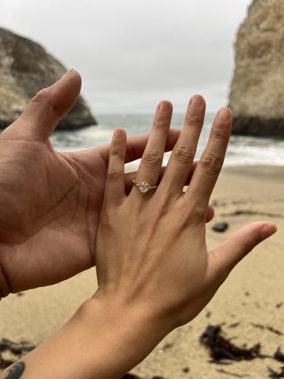 Oval diamond ring on hand