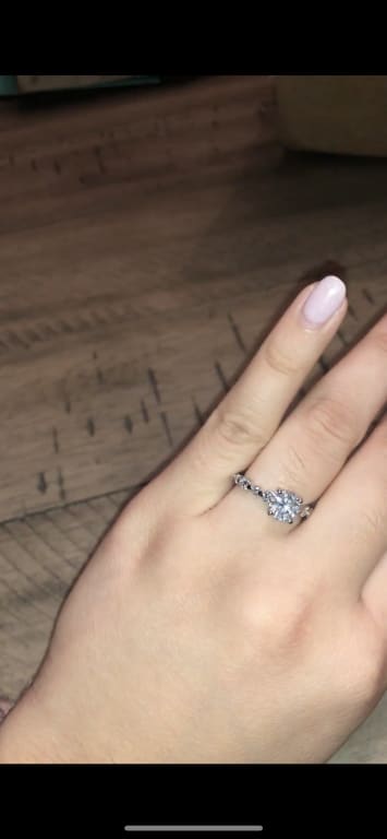Oval diamond ring on hand