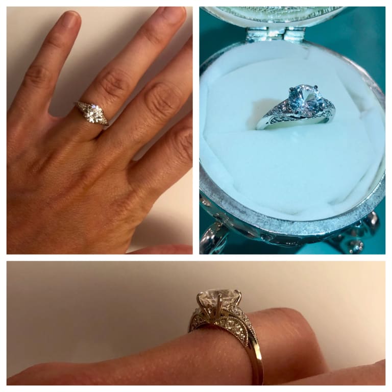 Oval diamond ring on hand