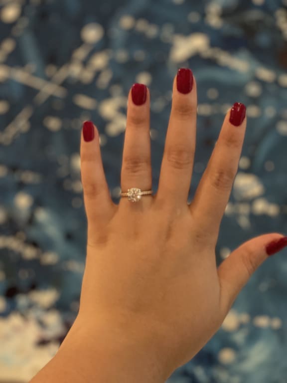 Oval diamond ring on hand