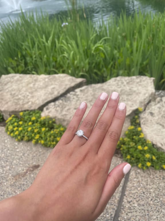 Oval diamond ring on hand