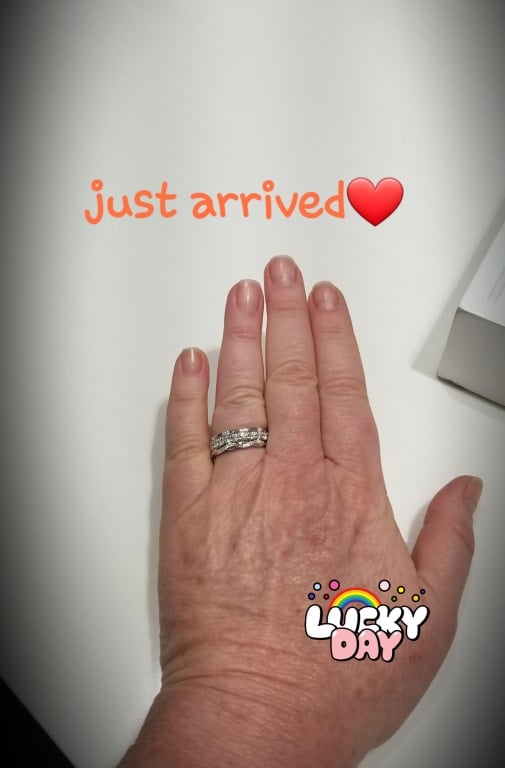 Oval diamond ring on hand