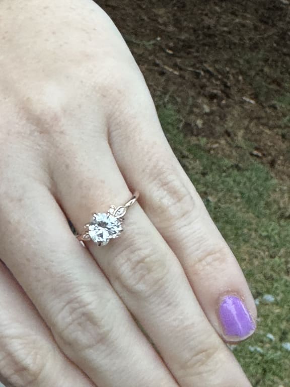Oval diamond ring on hand
