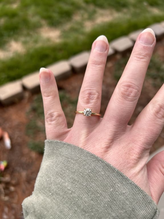Oval diamond ring on hand