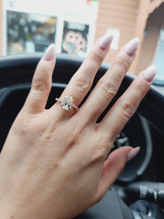 Oval diamond ring on hand