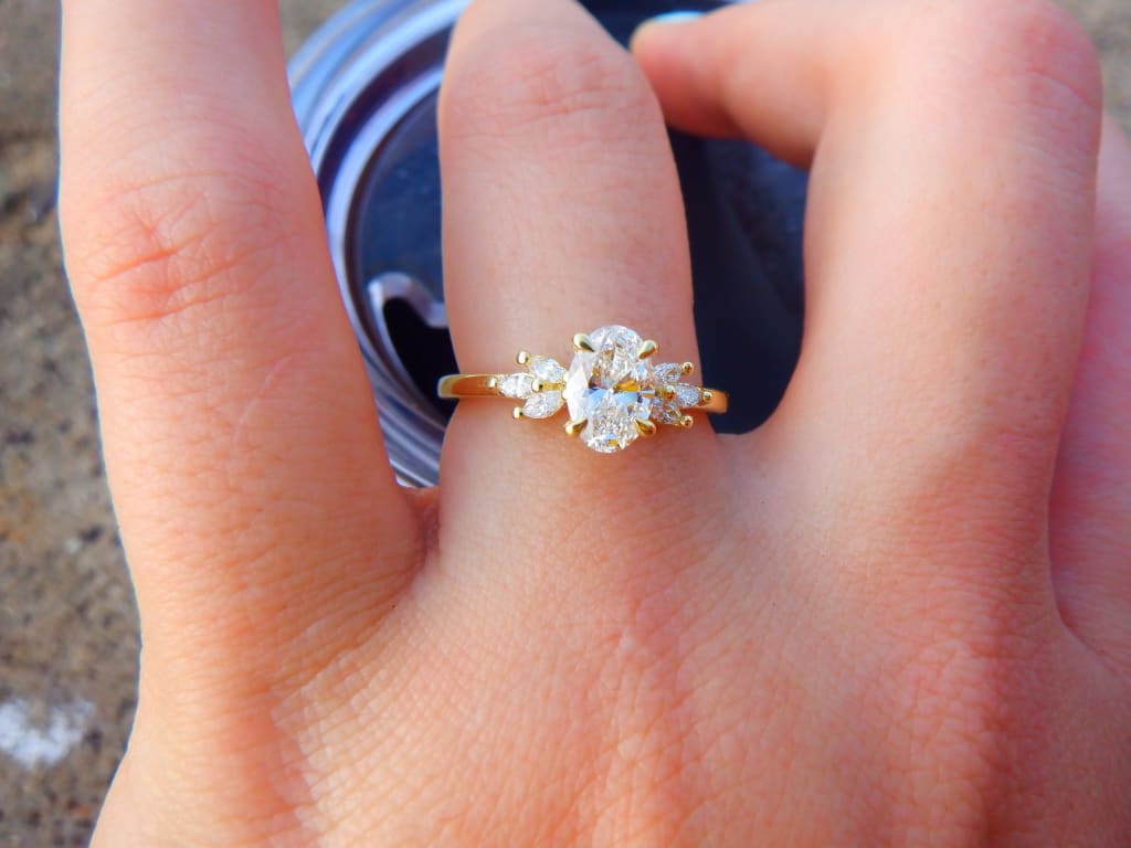 Oval diamond ring on hand