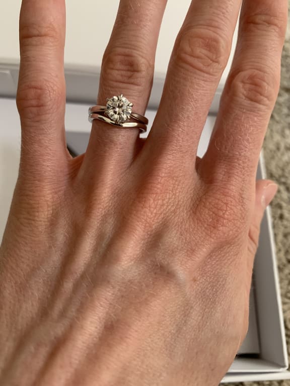 Oval diamond ring on hand