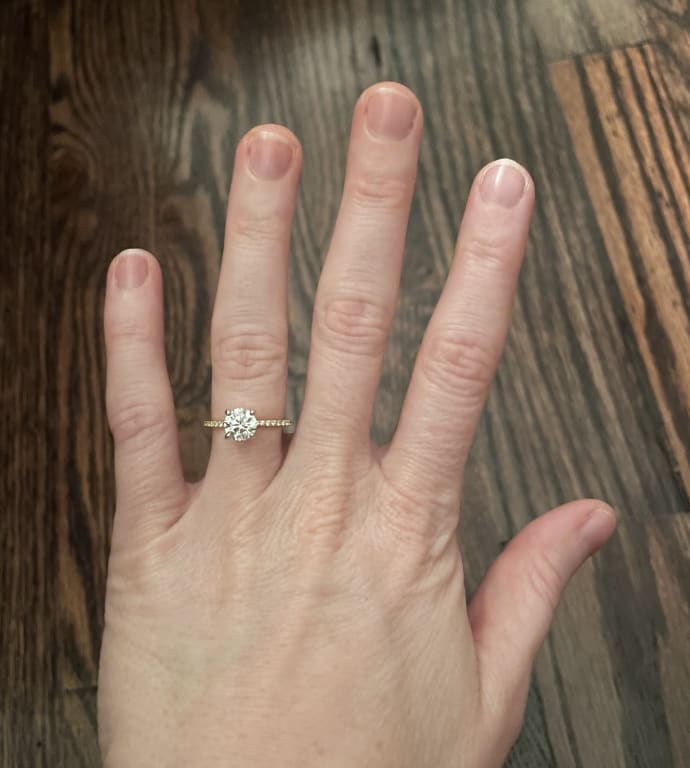 Oval diamond ring on hand