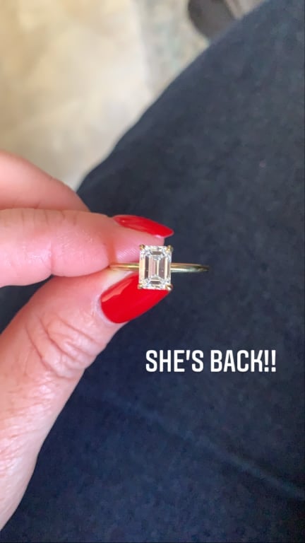 Oval diamond ring on hand
