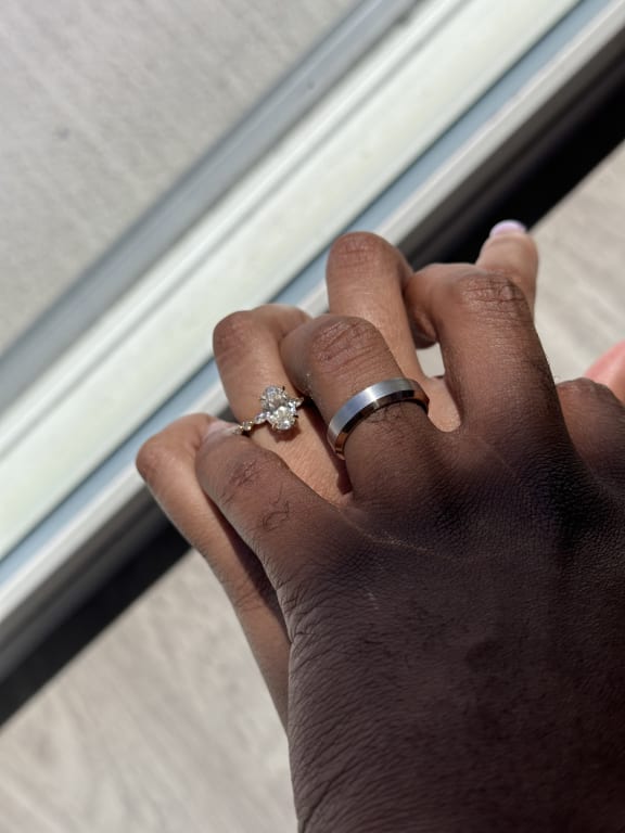 Oval diamond ring on hand