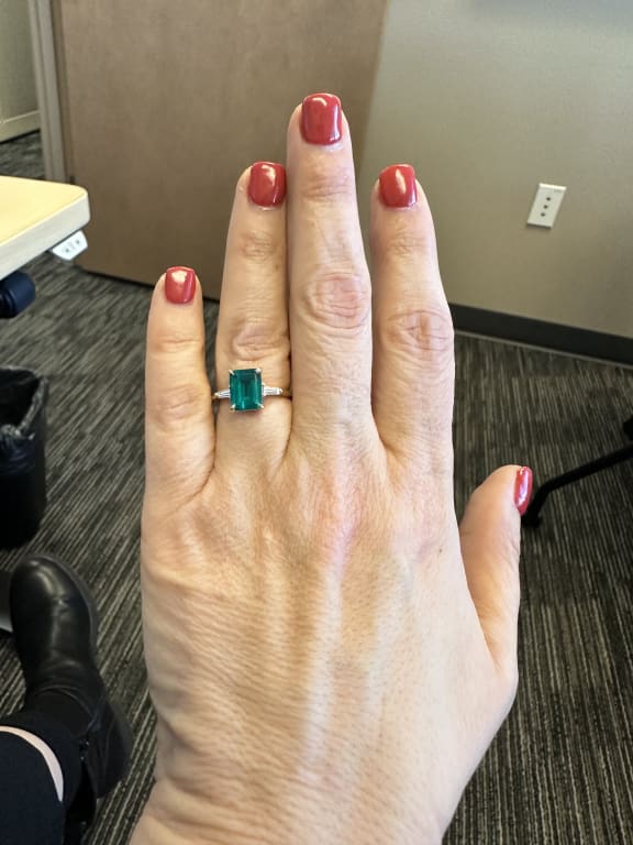 Oval diamond ring on hand