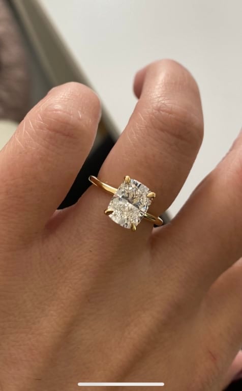 Oval diamond ring on hand