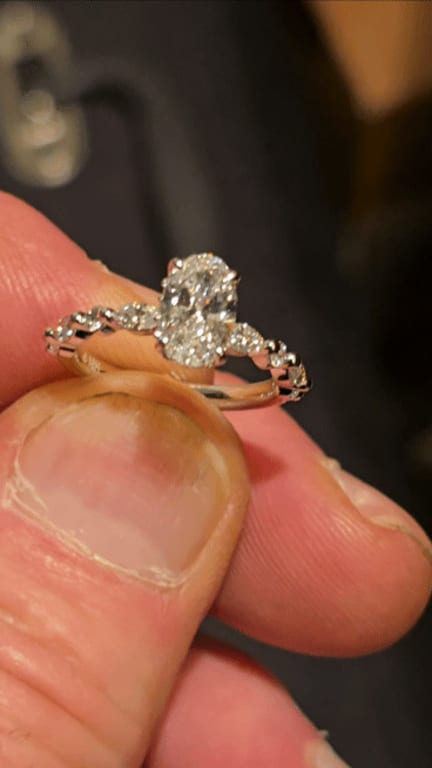 Oval diamond ring on hand