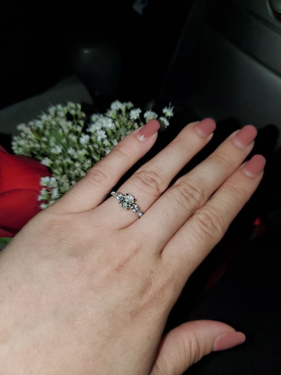 Oval diamond ring on hand