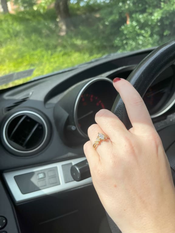 Oval diamond ring on hand