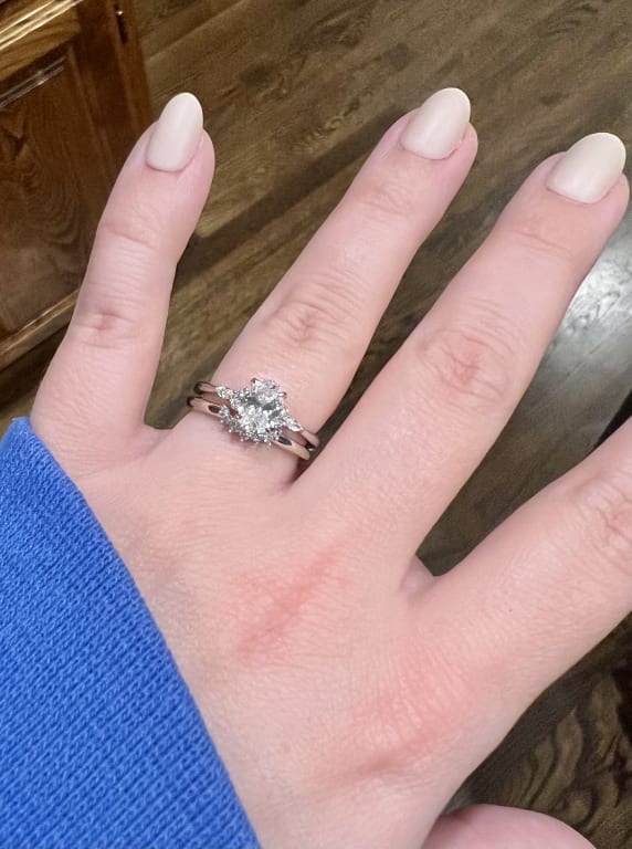 Oval diamond ring on hand